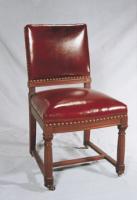 LEATHER AND MAHOGANY CHAIR DECORATED WITH SMALL ANTIQUE BRASS BUTTONS